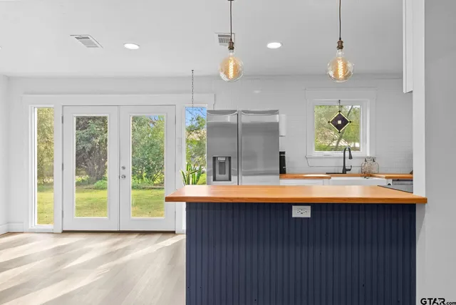 a view of kitchen with a window and a sink