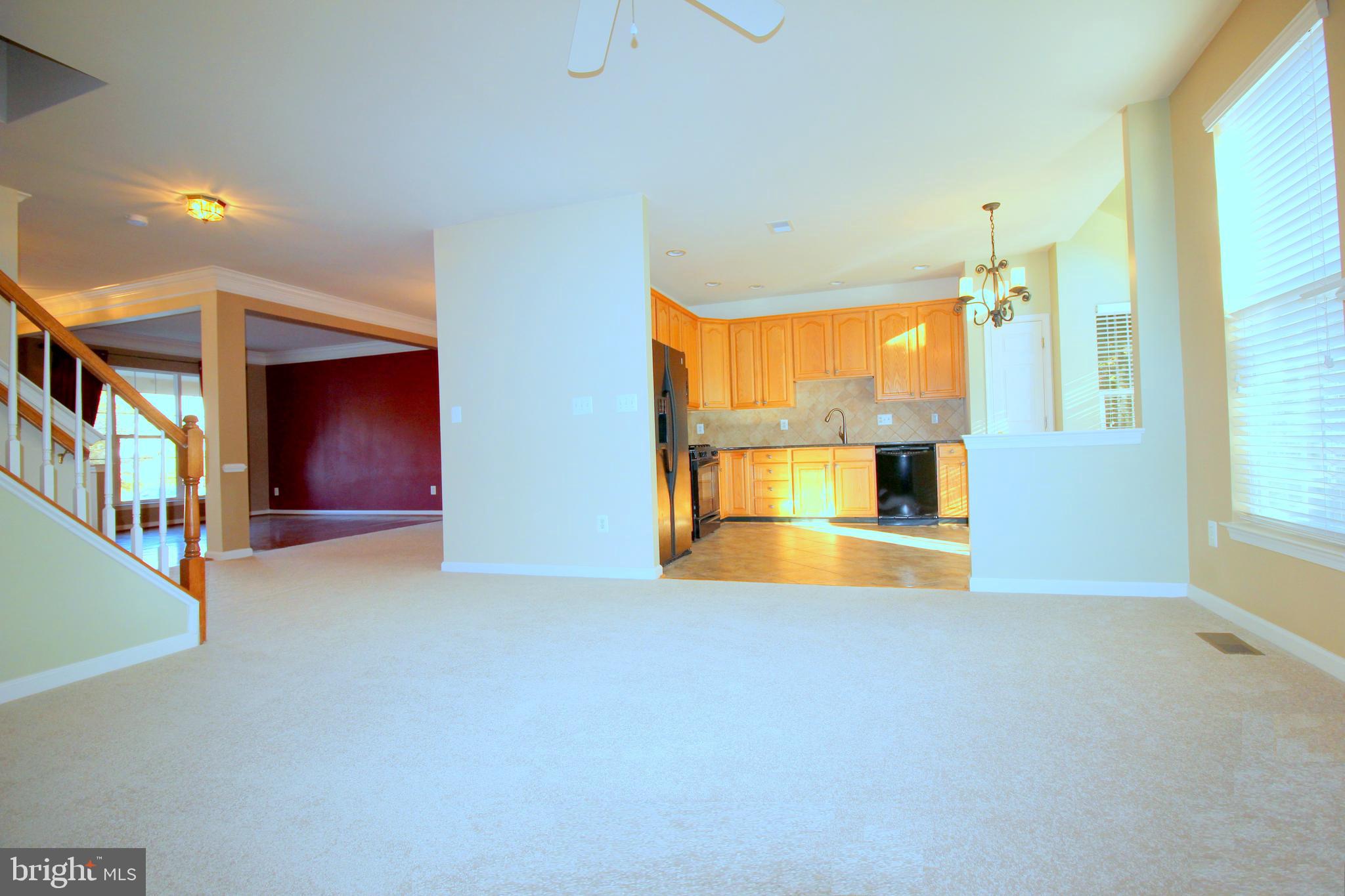 43605 Ryder Cup Square Ashburn, VA 20147 - Photo 48 of 48 a view of an empty room with a window and wooden floor