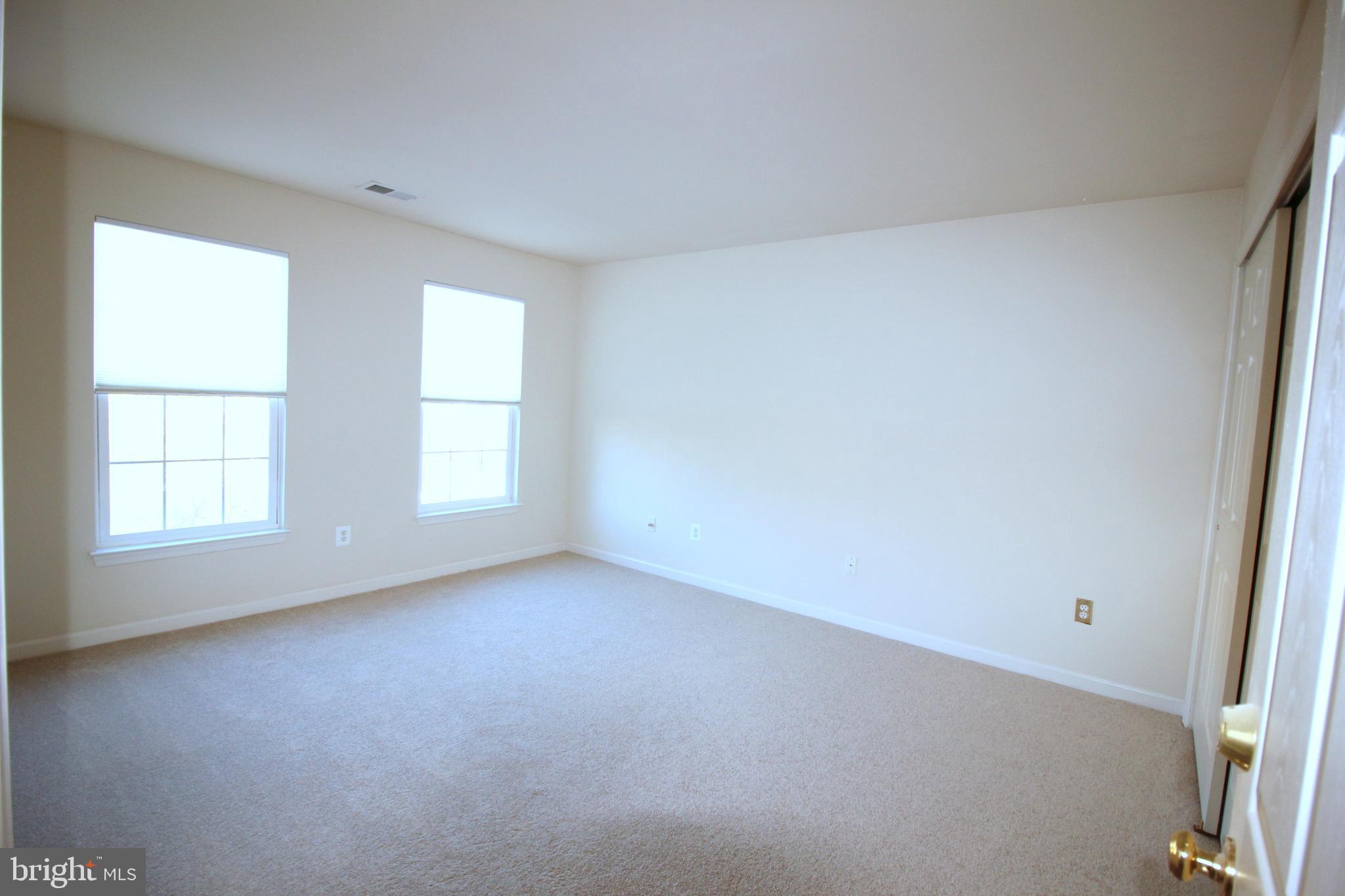 43605 Ryder Cup Square Ashburn, VA 20147 - Photo 19 of 48 an empty room with windows