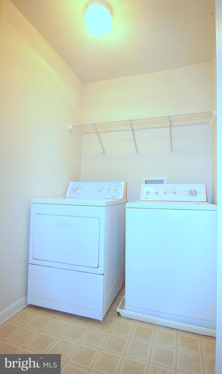 43605 Ryder Cup Square Ashburn, VA 20147 - Photo 23 of 48 a utility room with dryer and washer