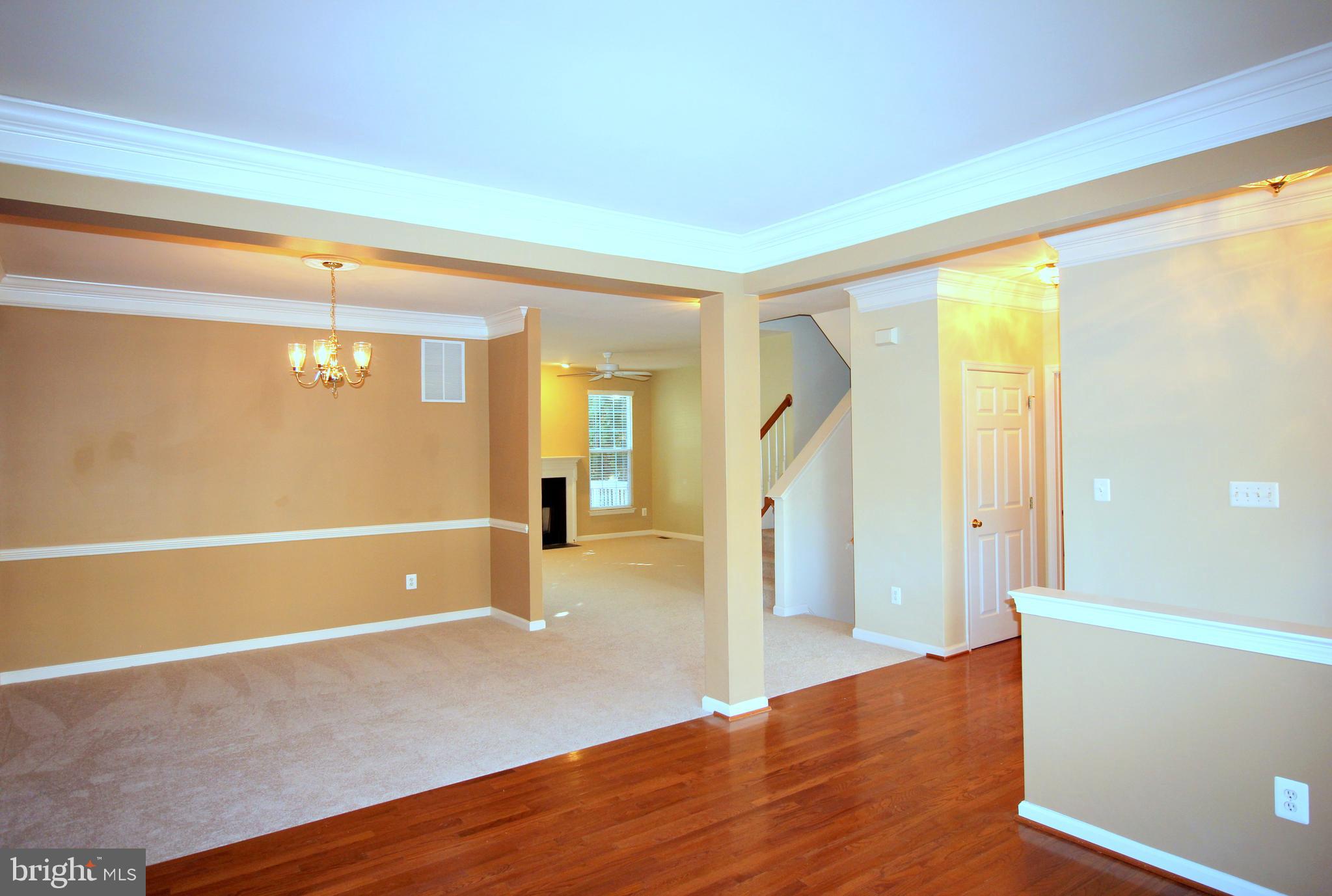 43605 Ryder Cup Square Ashburn, VA 20147 - Photo 4 of 48 a view of a room with wooden floor and stairs