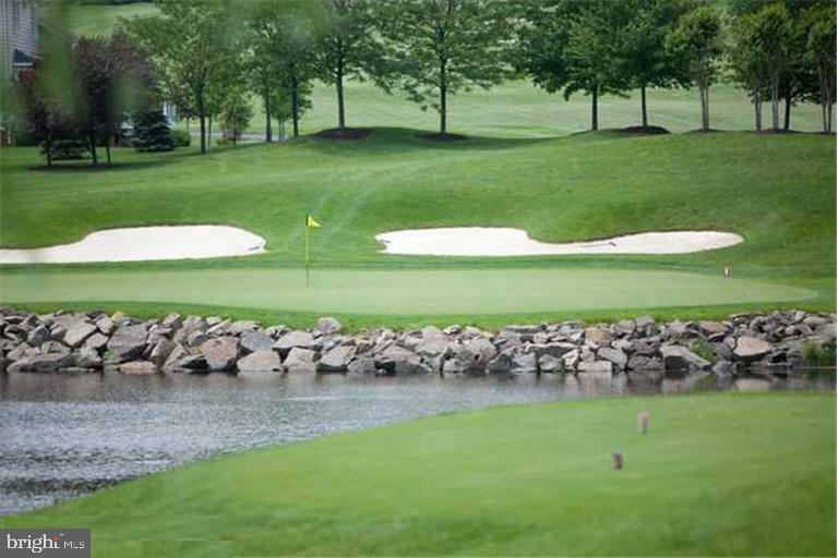 43605 Ryder Cup Square Ashburn, VA 20147 - Photo 31 of 48 a view of a golf course with a bench