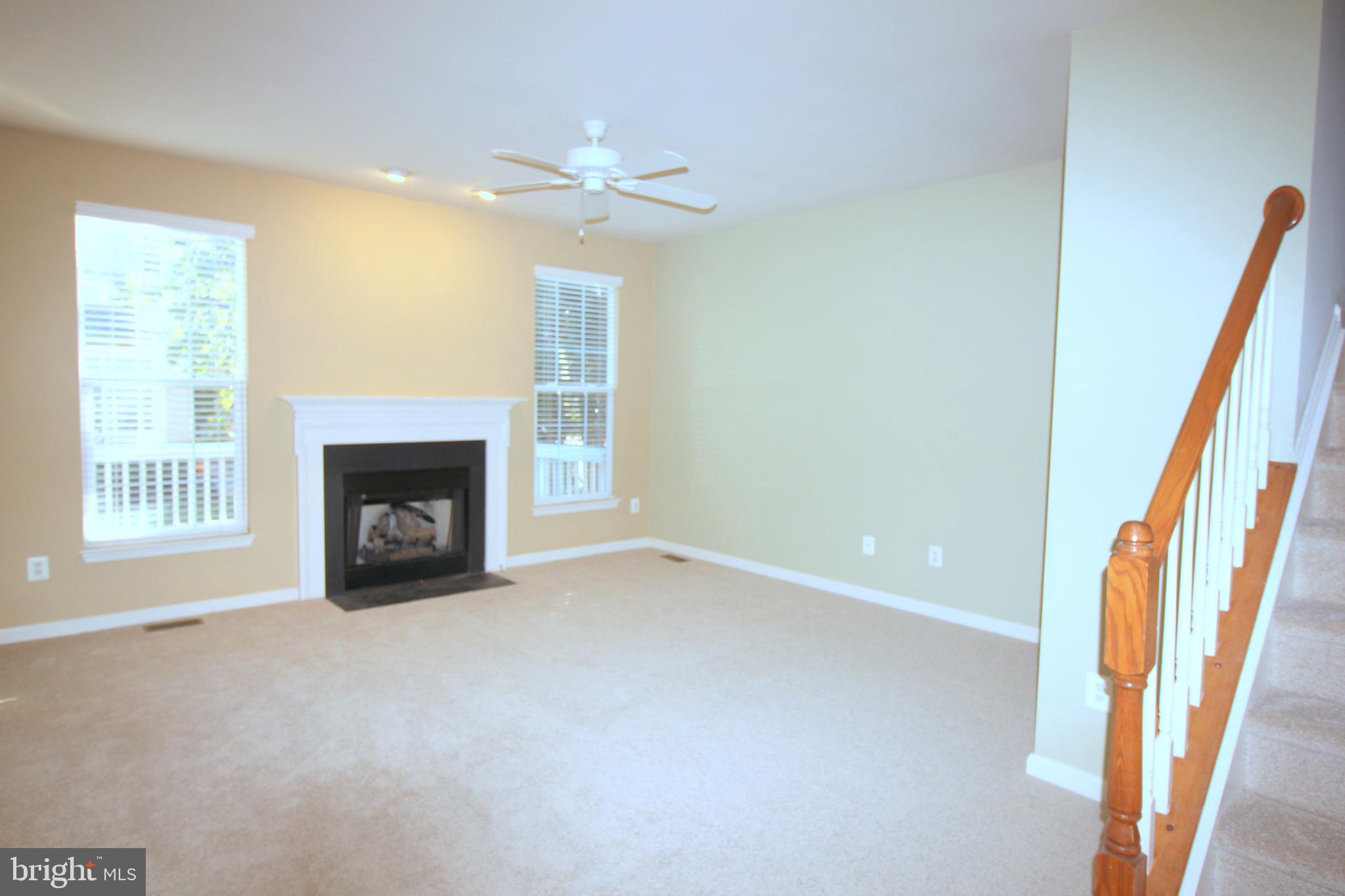 43605 Ryder Cup Square Ashburn, VA 20147 - Photo 7 of 48 a view of an empty room with a fireplace