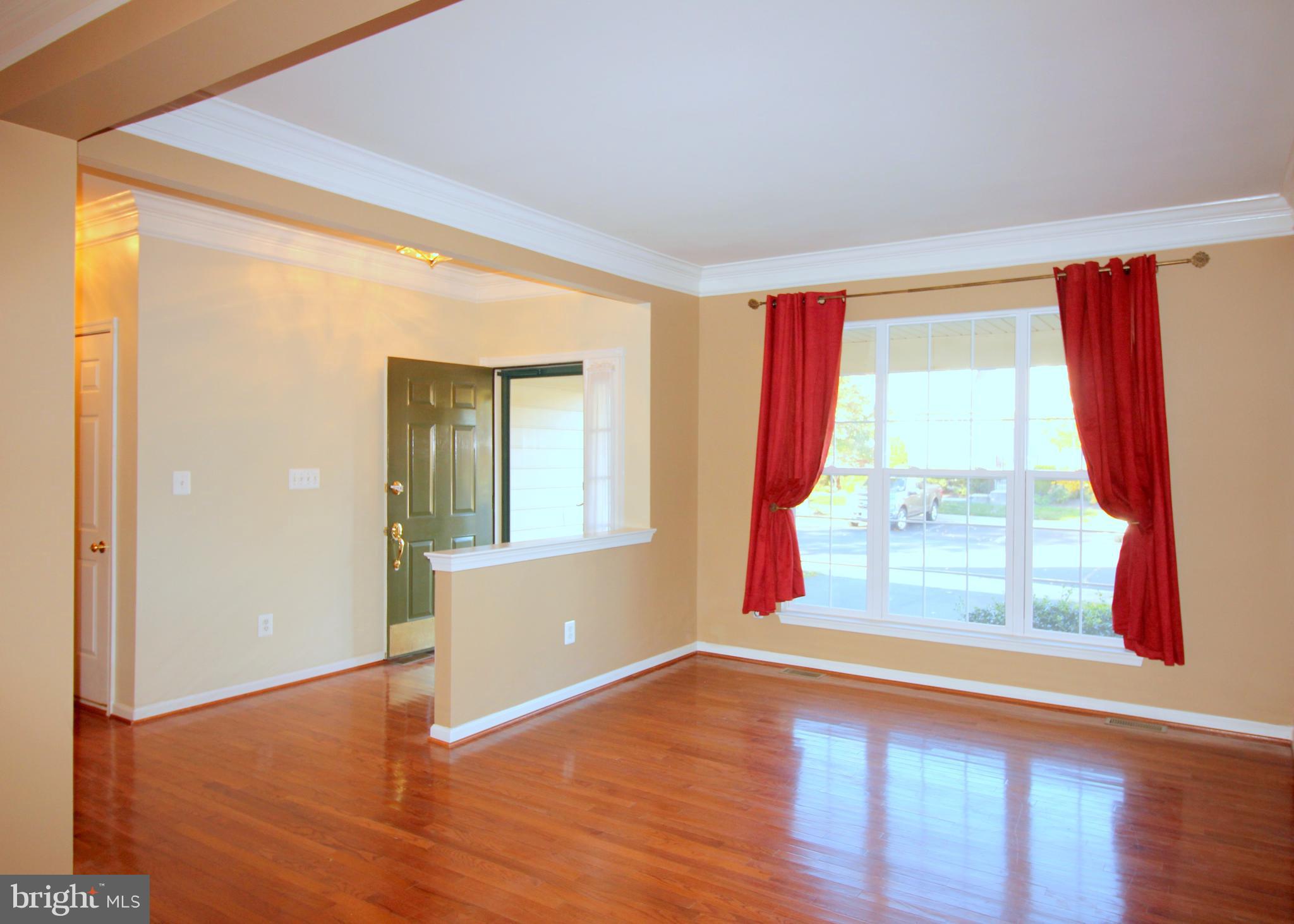 43605 Ryder Cup Square Ashburn, VA 20147 - Photo 8 of 48 a view of an empty room with wooden floor and a window