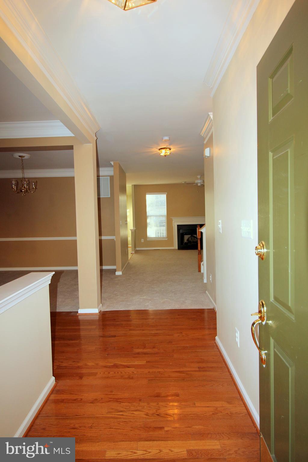 43605 Ryder Cup Square Ashburn, VA 20147 - Photo 9 of 48 a view of a hallway view with wooden floor and staircase