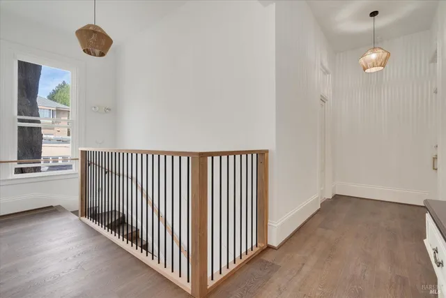 a kitchen with a refrigerator and a stove top oven