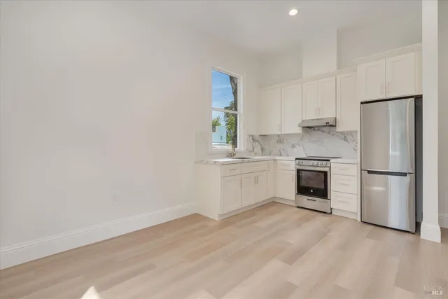 a bathroom with a sink toilet and mirror