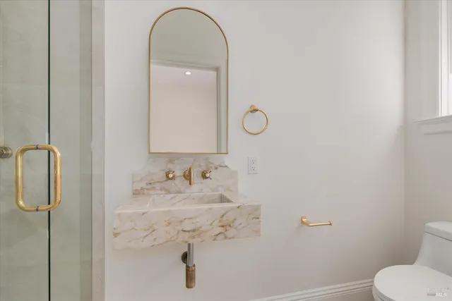a view of a bathroom from the hallway