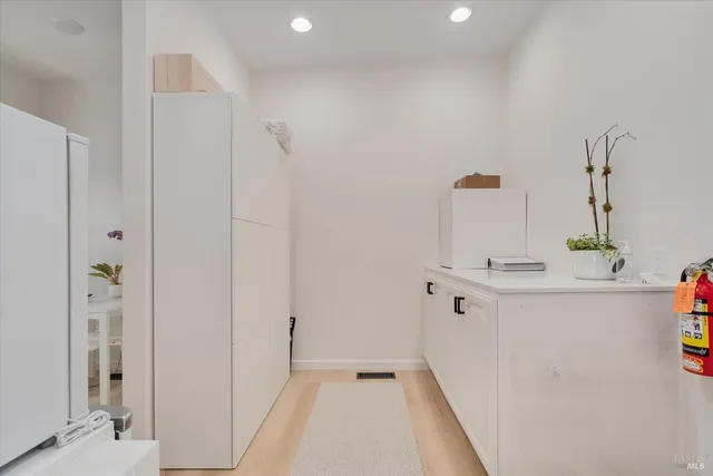 a living room with furniture and potted plant
