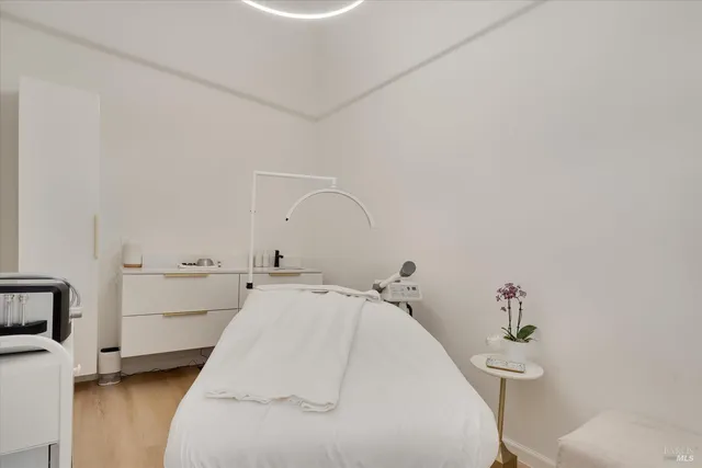 a view of entryway with stairs and wooden floor