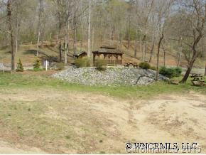 26 River Ridge Parkway, Unit 26 Rutherfordton, NC 28139 - Photo 6 of 12 a view of a garden with a bench