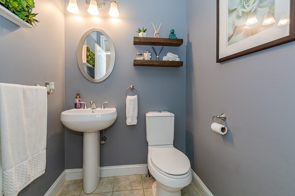 30 April's Way Tewksbury, MA 01876 - Photo 11 of 42 a bathroom with a toilet sink and mirror