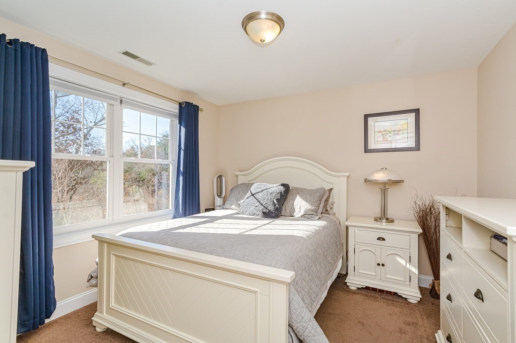 30 April's Way Tewksbury, MA 01876 - Photo 14 of 42 a bedroom with a bed and a window