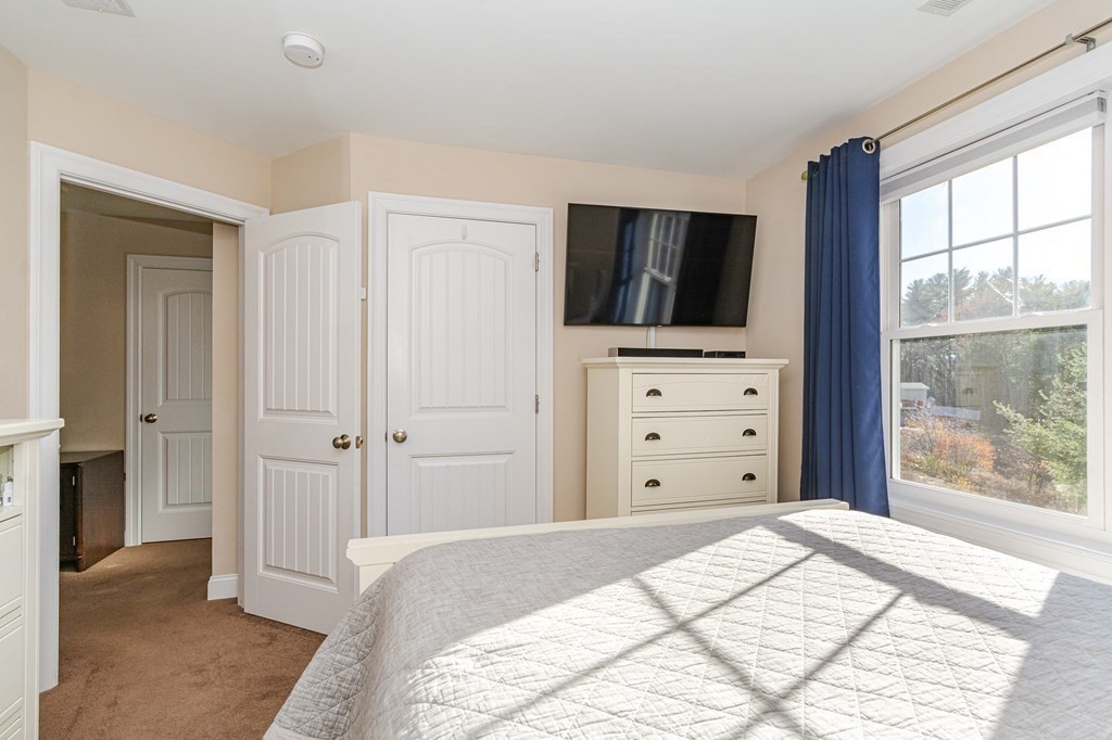 30 April's Way Tewksbury, MA 01876 - Photo 15 of 42 a bed room with a bed and television