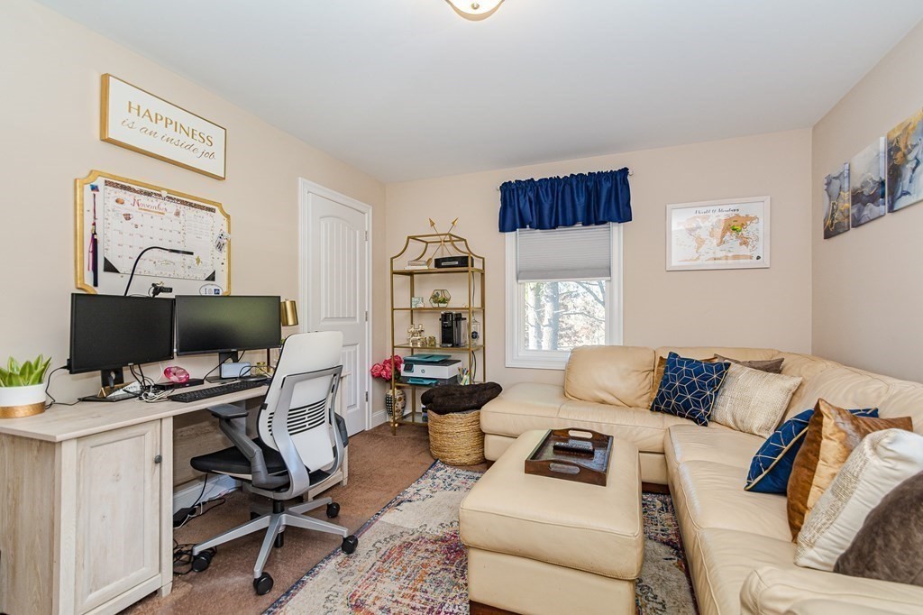30 April's Way Tewksbury, MA 01876 - Photo 17 of 42 a living room with furniture and a window