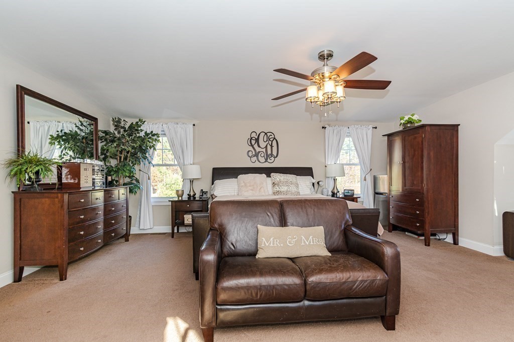 30 April's Way Tewksbury, MA 01876 - Photo 24 of 42 a living room with furniture and a lamp