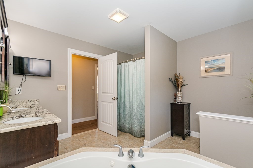 30 April's Way Tewksbury, MA 01876 - Photo 27 of 42 a bathroom with a sink and a mirror