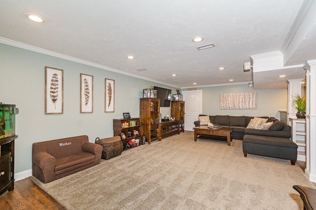 30 April's Way Tewksbury, MA 01876 - Photo 28 of 42 a living room with furniture and a large window