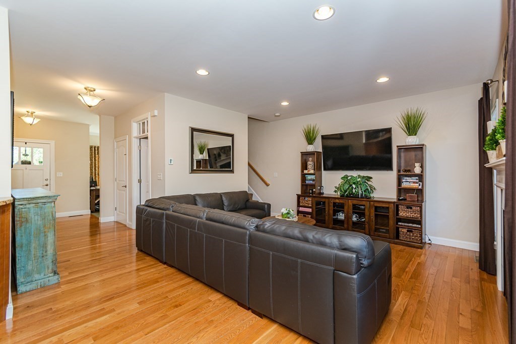30 April's Way Tewksbury, MA 01876 - Photo 3 of 42 a living room with furniture and a flat screen tv