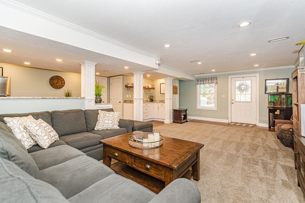 30 April's Way Tewksbury, MA 01876 - Photo 31 of 42 a living room with furniture and wooden floor