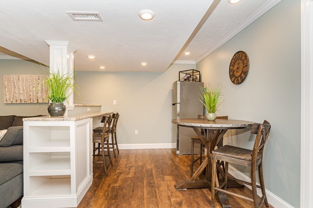 30 April's Way Tewksbury, MA 01876 - Photo 32 of 42 a view of a dining room with furniture and a wooden floor