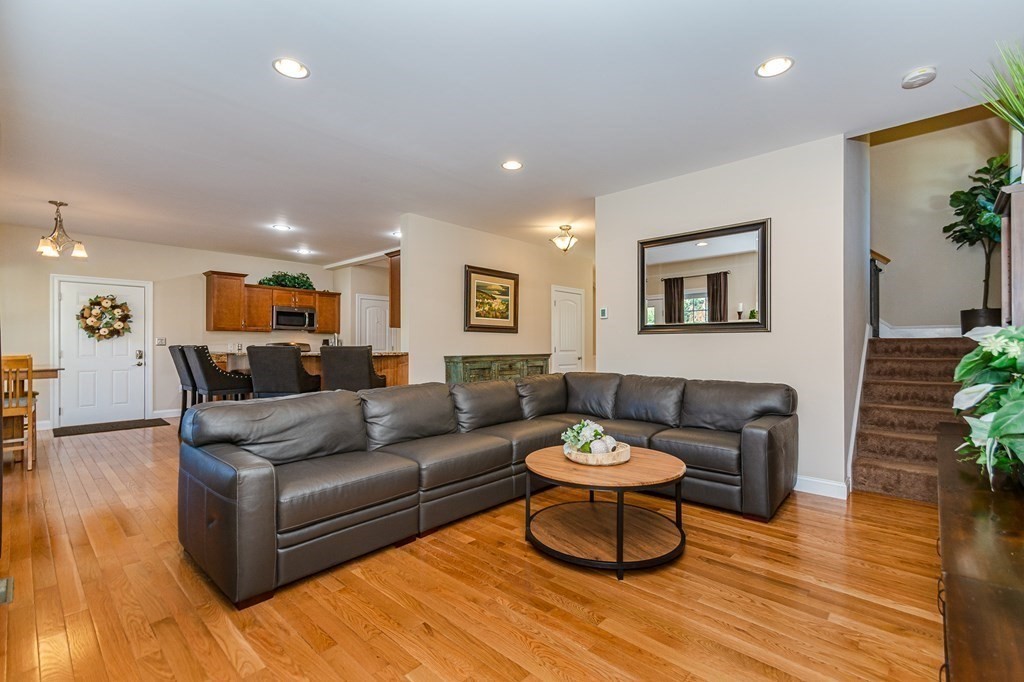 30 April's Way Tewksbury, MA 01876 - Photo 4 of 42 a living room with furniture and a wooden floor