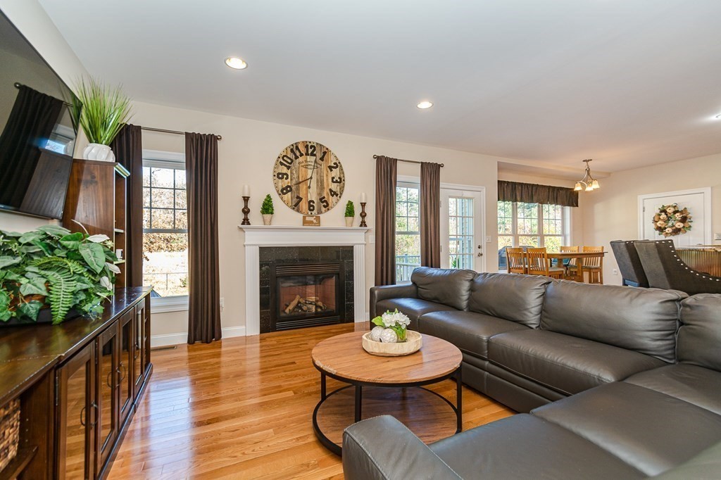 30 April's Way Tewksbury, MA 01876 - Photo 5 of 42 a living room with furniture and a fireplace