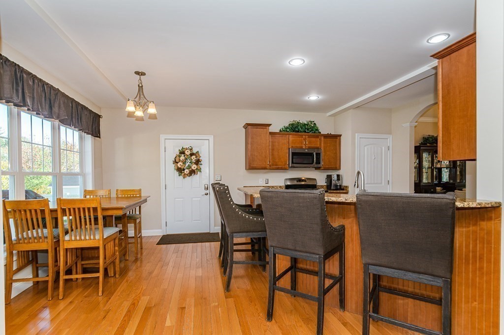 30 April's Way Tewksbury, MA 01876 - Photo 7 of 42 a view of a dining room with furniture window and wooden floor