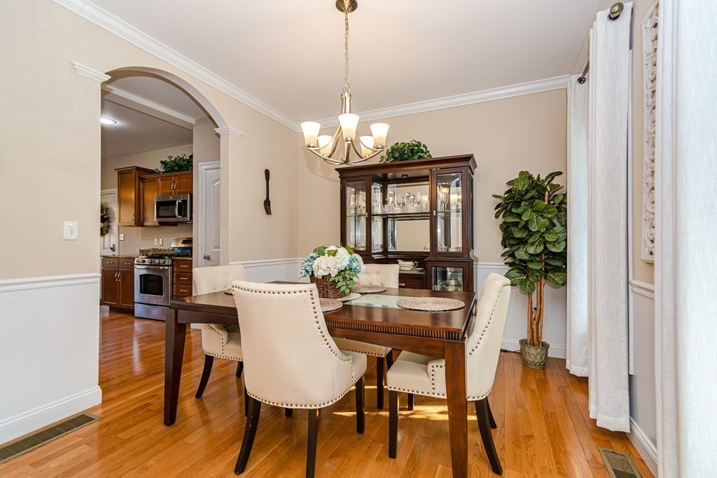 30 April's Way Tewksbury, MA 01876 - Photo 10 of 42 a view of a dining room with furniture and wooden floor
