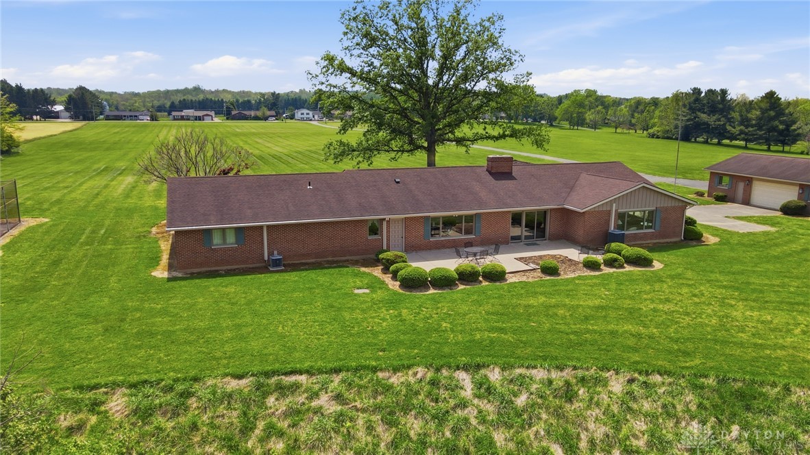 5669 O Neall Road Waynesville, OH 45068 - Photo 4 of 72 This ranch-style residence is set on an expansive, verdant lot, offering peaceful rural living.