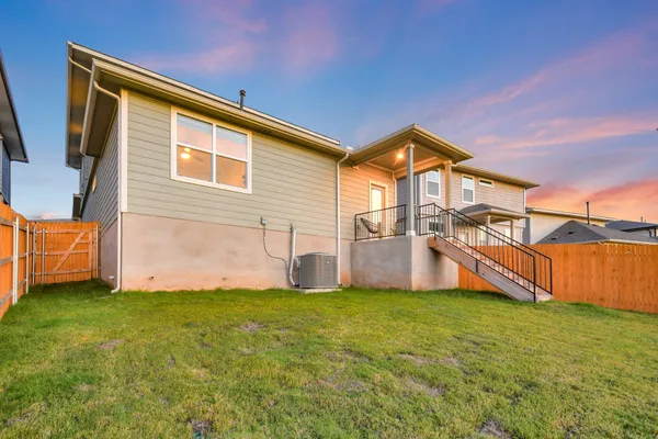 a view of a dining room with furniture and a window