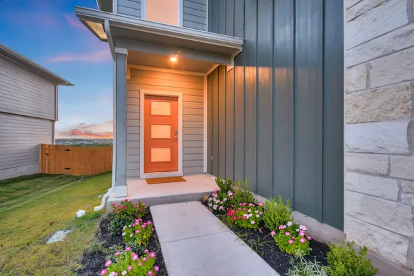 a view of a backyard with potted plants
