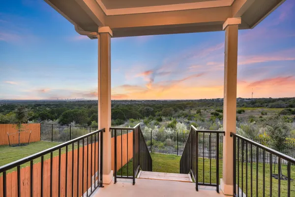 a view of a balcony with city view