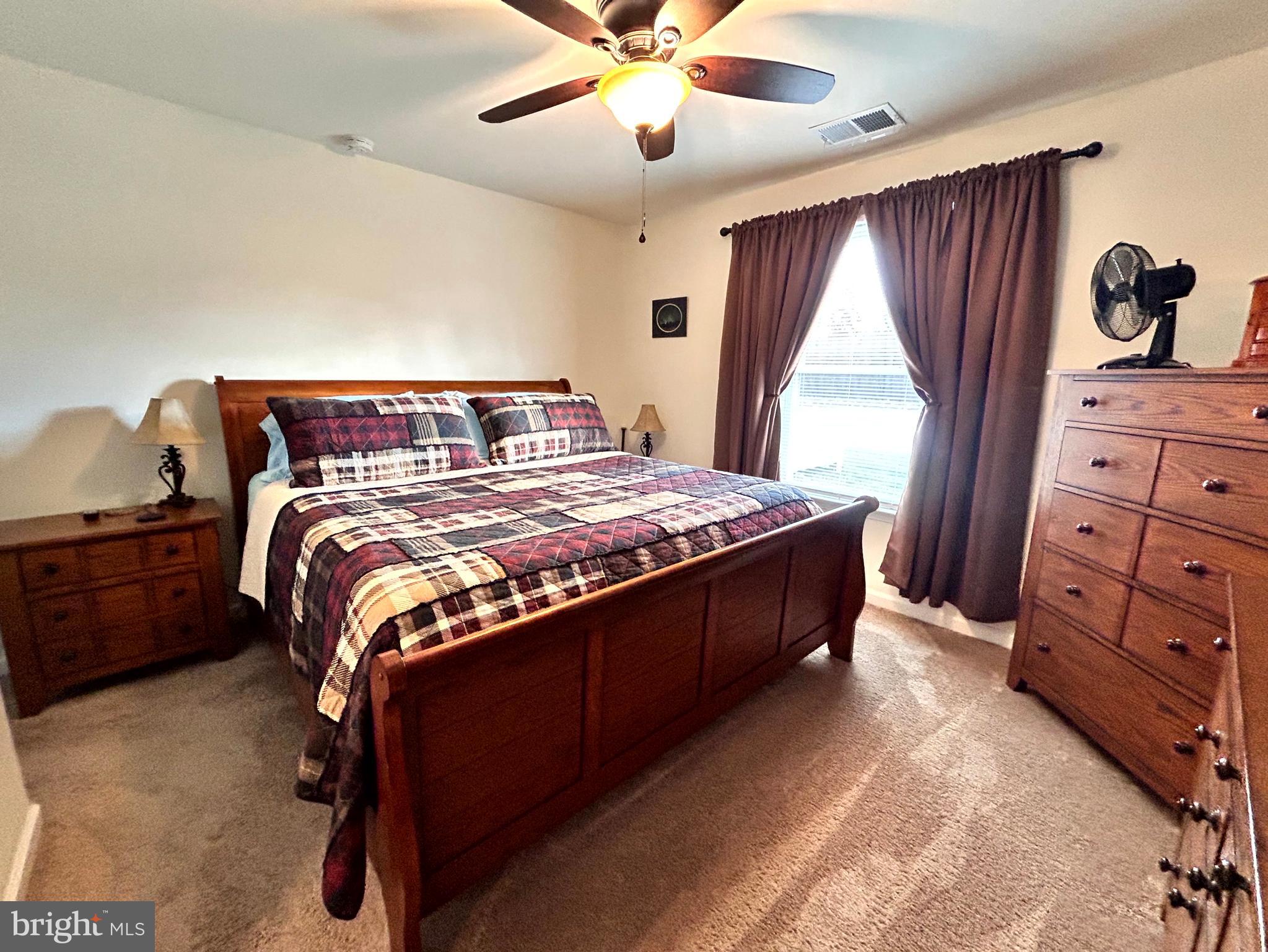 90 Rappahannock Run Falling Waters, WV 25419 - Photo 11 of 47 a bedroom with a bed and a window