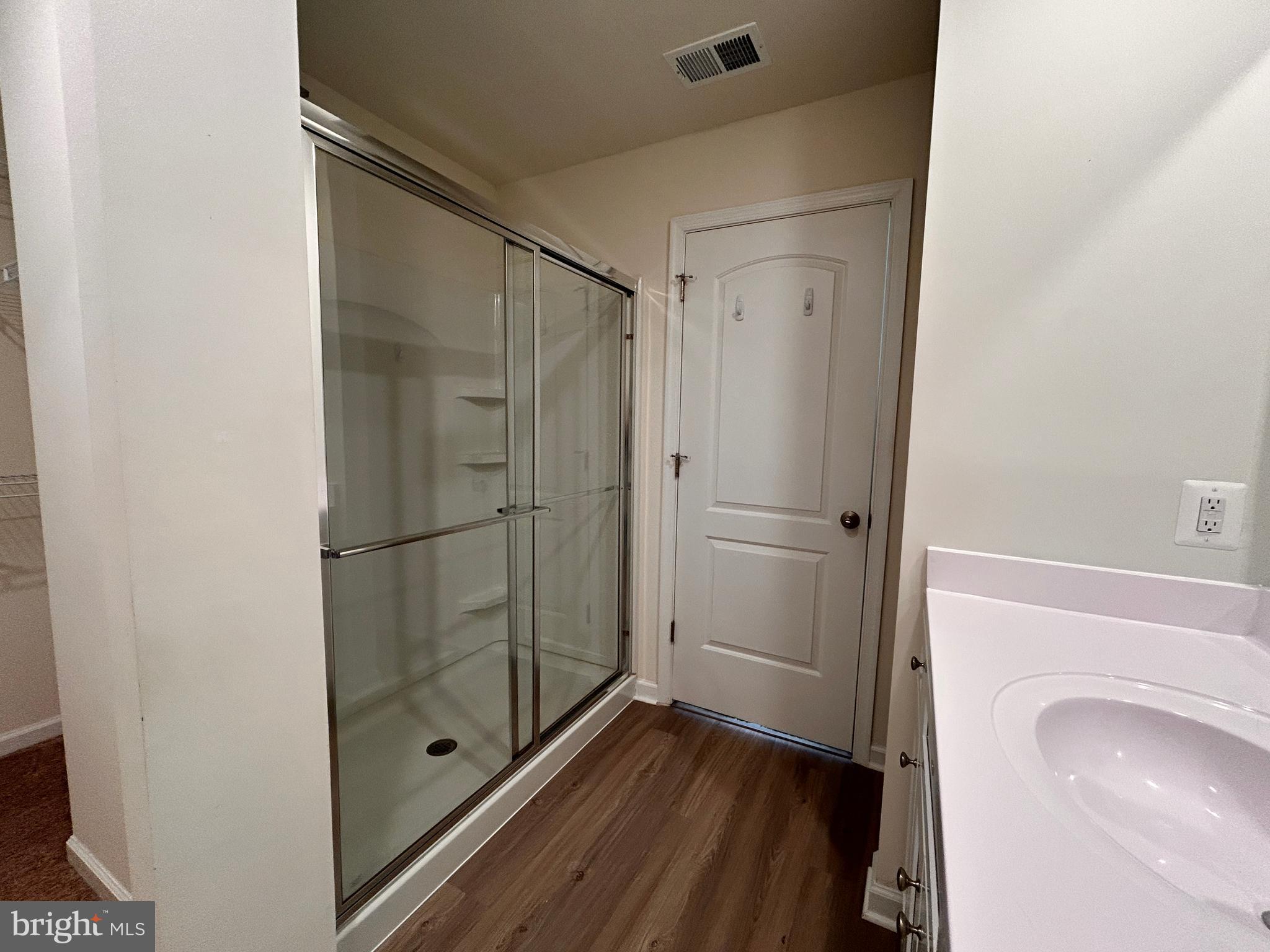 90 Rappahannock Run Falling Waters, WV 25419 - Photo 12 of 48 a bathroom with a glass shower door