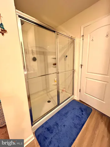 a bathroom with a tub and a shower