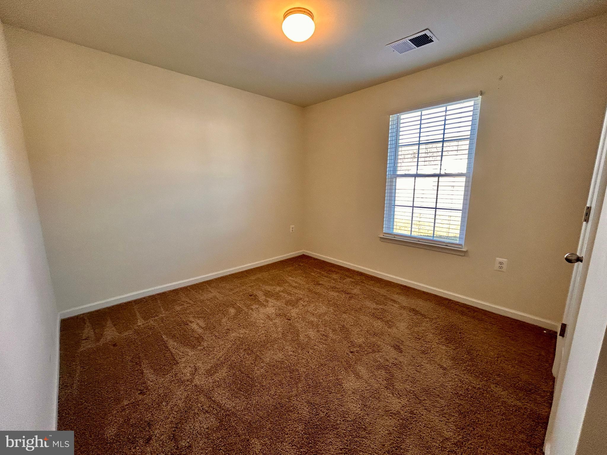 90 Rappahannock Run Falling Waters, WV 25419 - Photo 18 of 48 an empty room with windows and closet