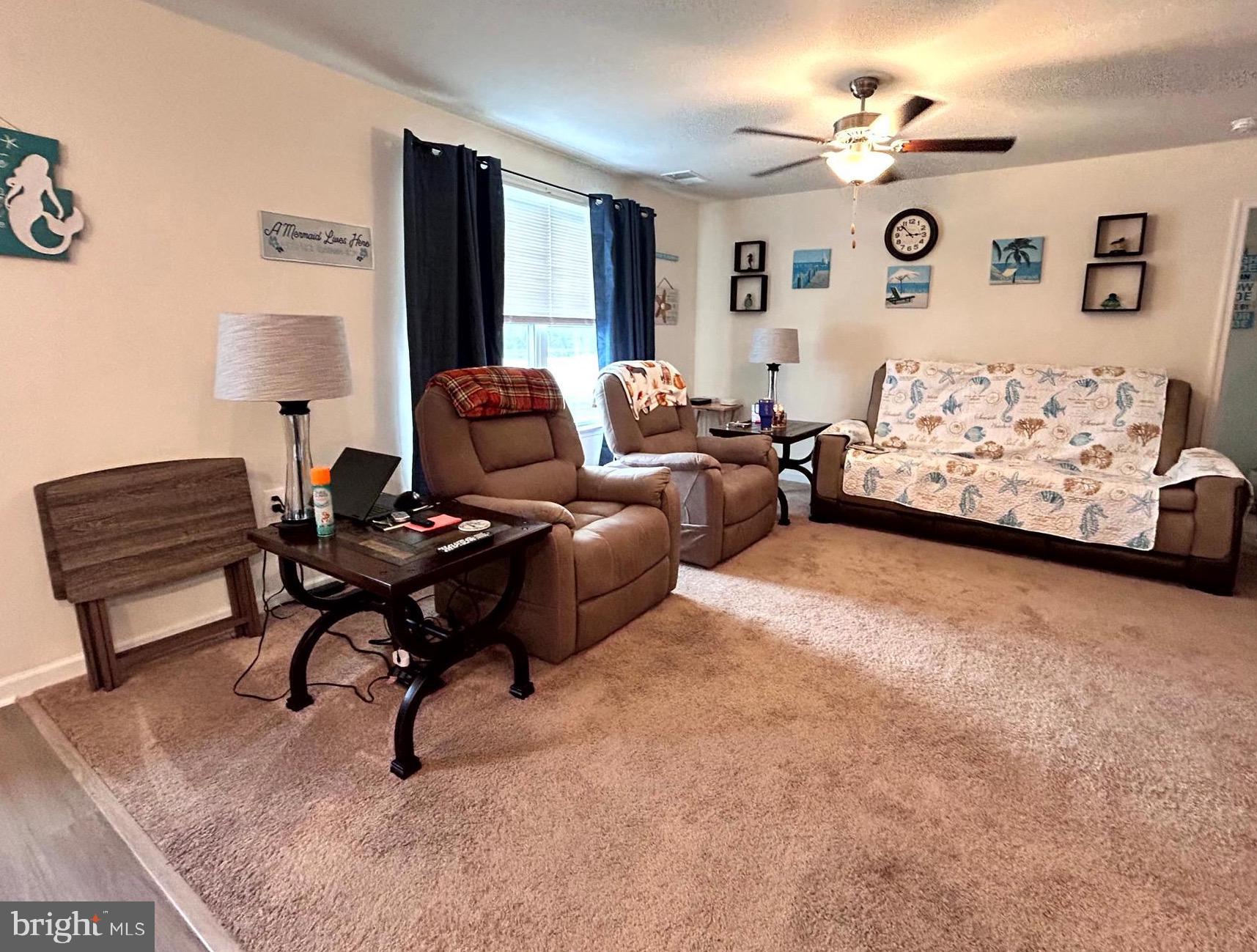 90 Rappahannock Run Falling Waters, WV 25419 - Photo 2 of 47 a living room with furniture a rug and a window
