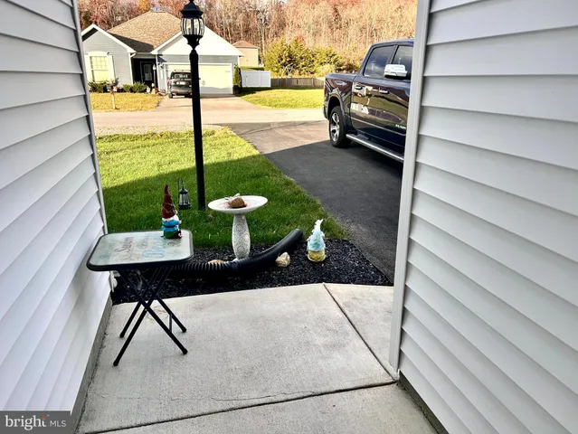 a view of a fountain in front of a house