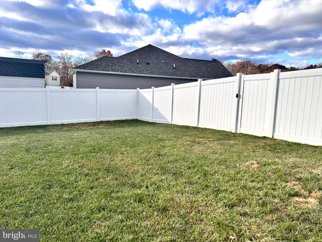 a view of a swimming pool with an outdoor seating