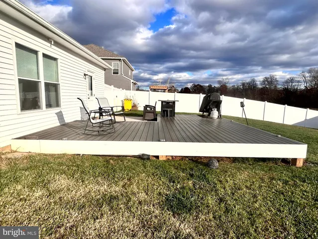 a view of chairs on wooden deck