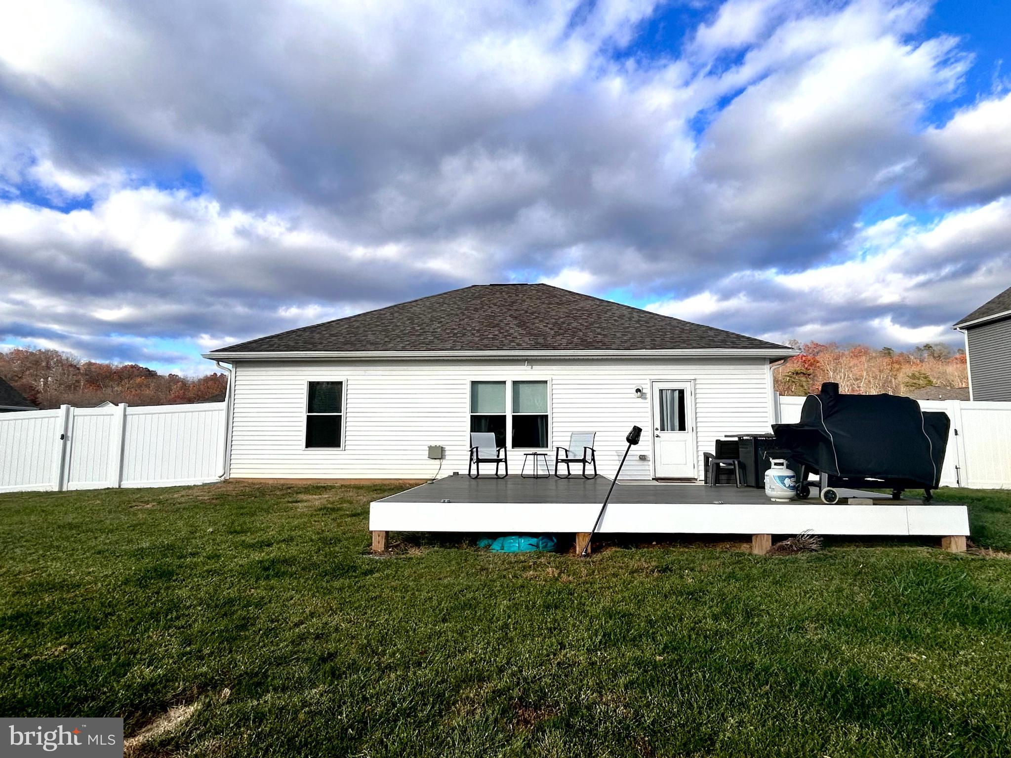 90 Rappahannock Run Falling Waters, WV 25419 - Photo 36 of 47 a front view of house with yard outdoor seating and barbeque oven