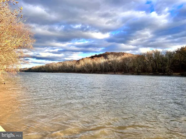 a view of a swimming pool with an ocean view