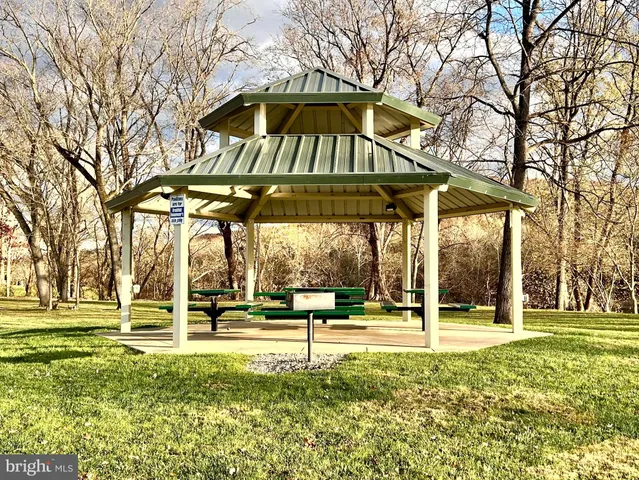 a view of a swimming pool with an outdoor space and seating area