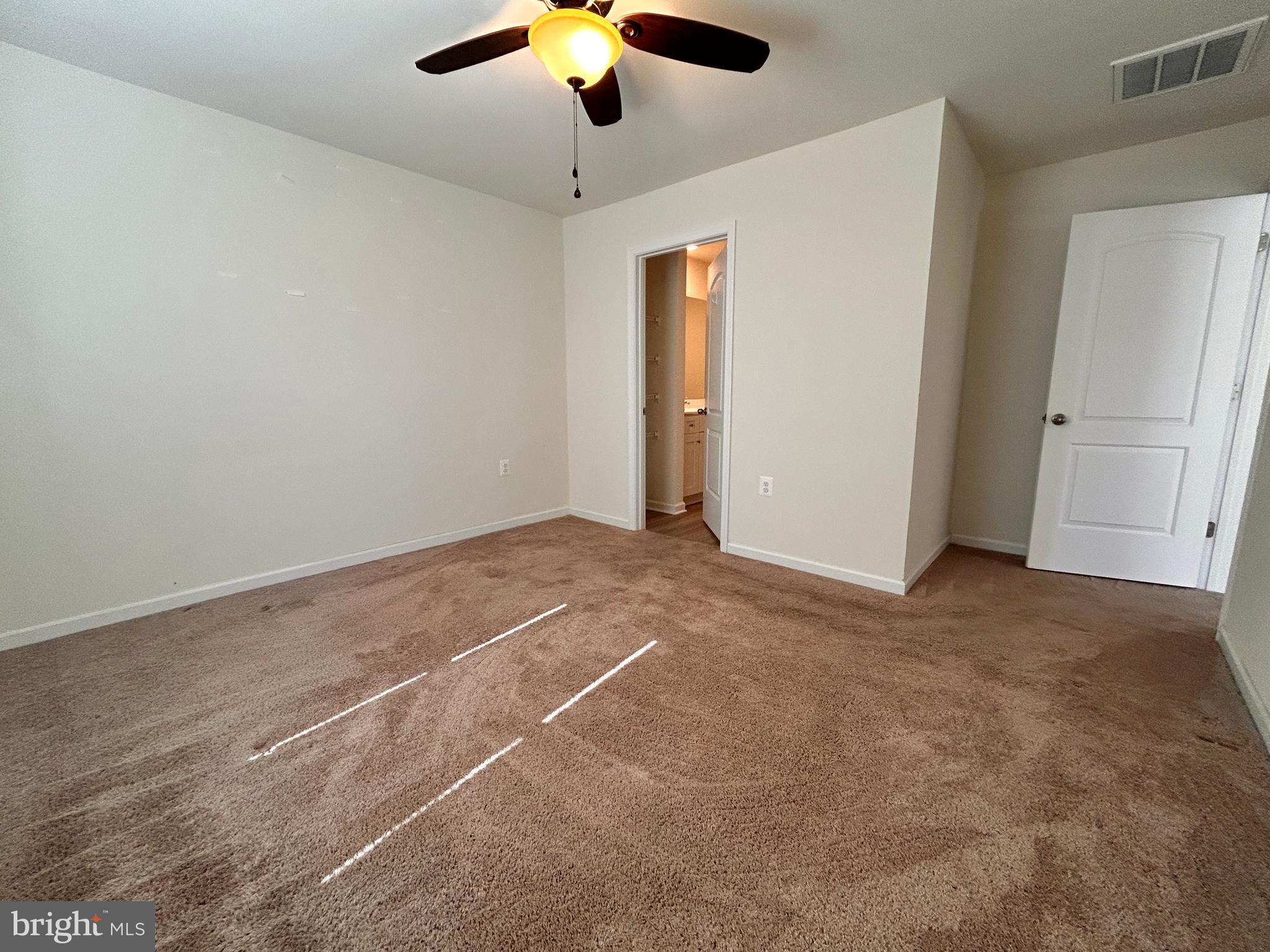 90 Rappahannock Run Falling Waters, WV 25419 - Photo 9 of 48 en empty room with ceiling fan and window