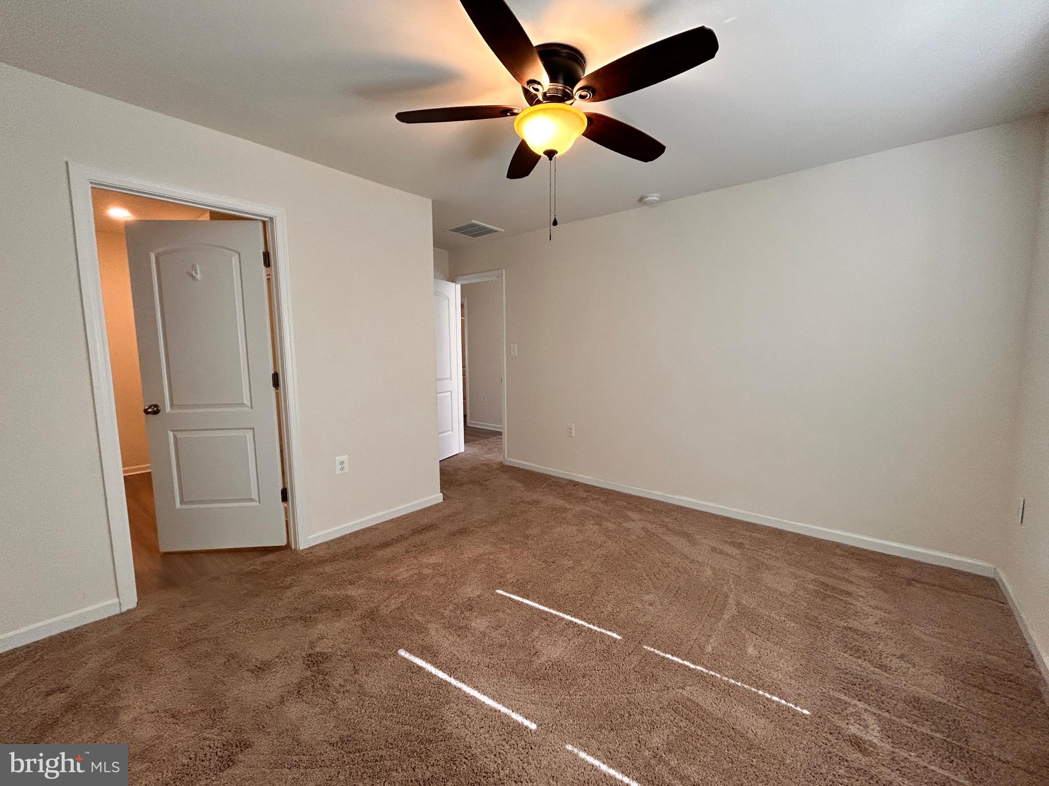90 Rappahannock Run Falling Waters, WV 25419 - Photo 10 of 48 an empty room with closet and fan