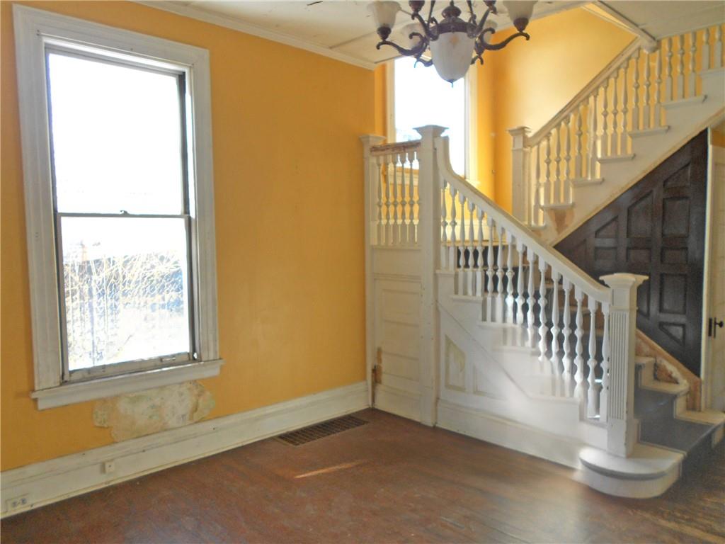 601 Locust Place Sewickley, PA 15143 - Photo 3 of 23 a view of staircase with railing and a chandelier