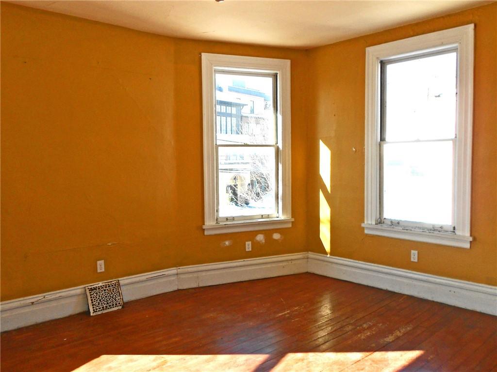 601 Locust Place Sewickley, PA 15143 - Photo 10 of 23 a view of an empty room with wooden floor and a window