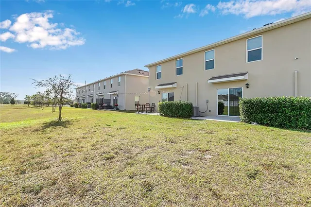 a view of a backyard of the house