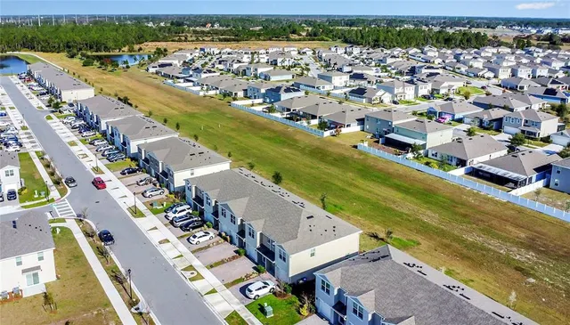 an aerial view of a house with swimming pool